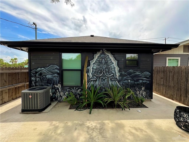 exterior space with cooling unit and a patio