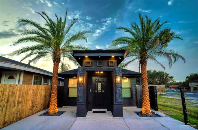 view of exterior entry at dusk