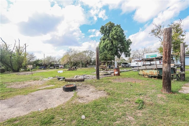 view of property's community with a yard