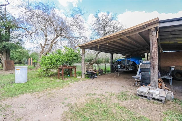 view of parking / parking lot featuring a carport