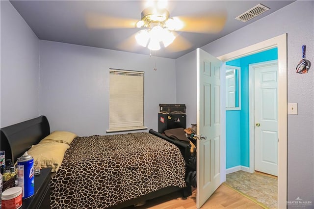 bedroom featuring ceiling fan and light hardwood / wood-style floors