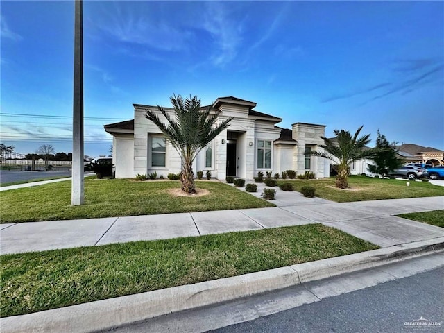 contemporary home with a front yard