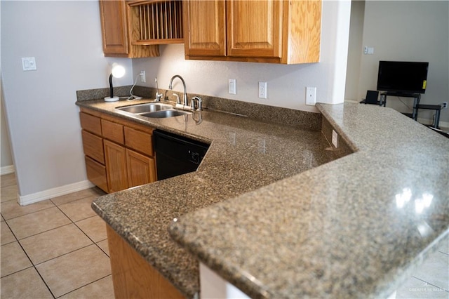 kitchen featuring black dishwasher, light tile patterned floors, sink, and dark stone counters