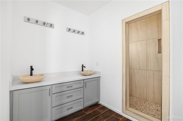 interior space with vanity and walk in shower