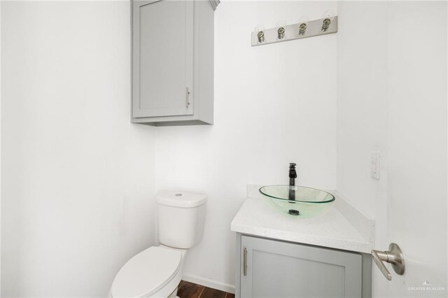 bathroom with vanity and toilet