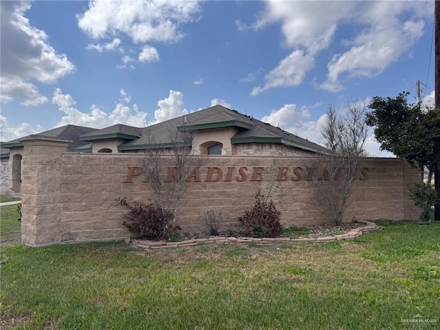 view of side of property with a lawn