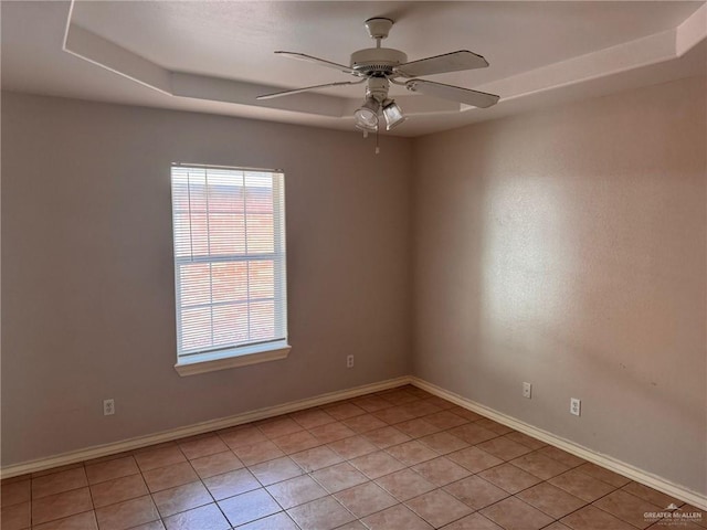 tiled empty room with ceiling fan