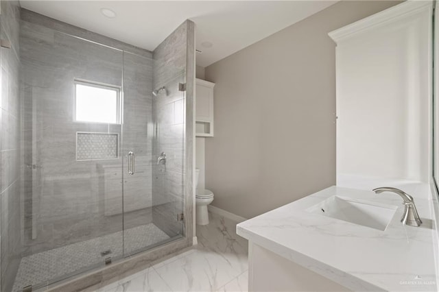 2005 Lime St, San Juan, TX 78589 - bathroom with toilet, a shower stall, marble finish flooring, vanity, and baseboards