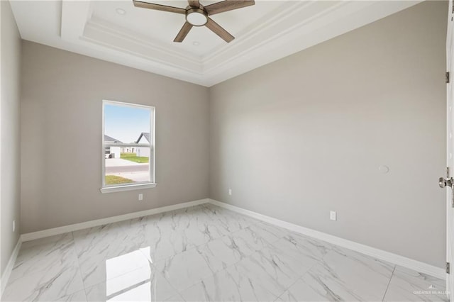 2005 Lime St, San Juan, TX 78589 - unfurnished room with light marble finish floors, a tray ceiling, ceiling fan, and baseboards