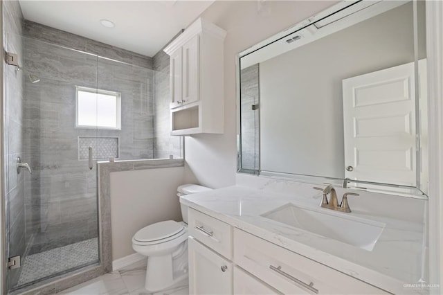 2005 Lime St, San Juan, TX 78589 - bathroom with toilet, a shower stall, marble look tile flooring, and vanity