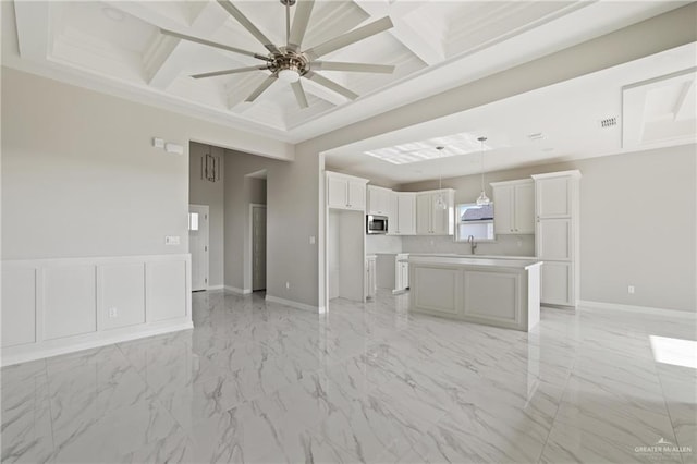 2005 Lime St, San Juan, TX 78589 - unfurnished living room featuring coffered ceiling, a ceiling fan, baseboards, light marble finish flooring, and a sink