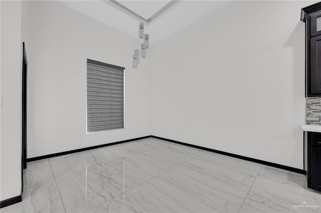 4120 Wisteria Ave, Mcallen, TX 78504 - unfurnished room featuring light marble finish flooring and baseboards