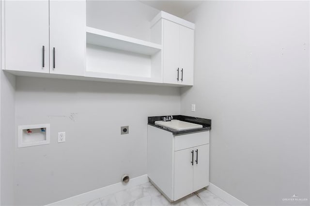 laundry room featuring cabinets, sink, washer hookup, and hookup for an electric dryer