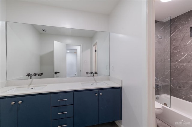 bathroom featuring vanity and  shower combination