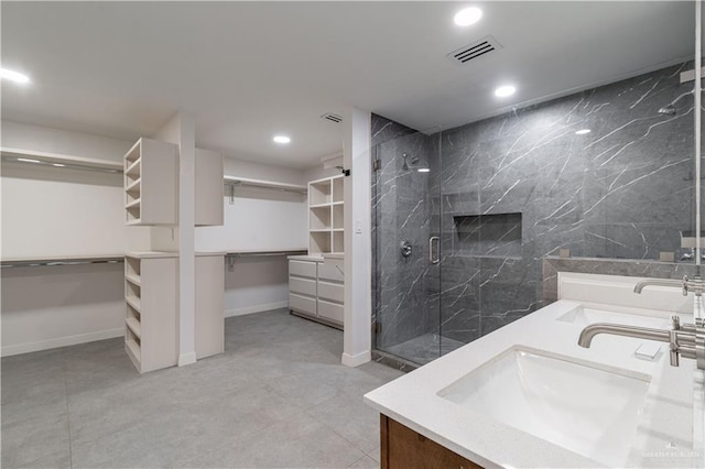 bathroom with vanity and walk in shower