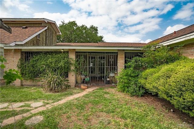501 W Esperanza Ave, Mcallen, TX 78501 - rear view of house with a shingled roof and brick siding