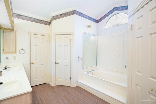 501 W Esperanza Ave, Mcallen, TX 78501 - bathroom featuring a tub to relax in, wood finished floors, crown molding, and double vanity