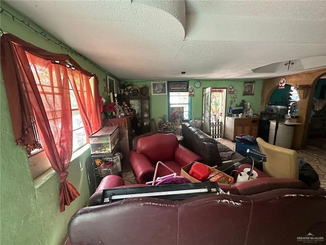 living room with a textured ceiling