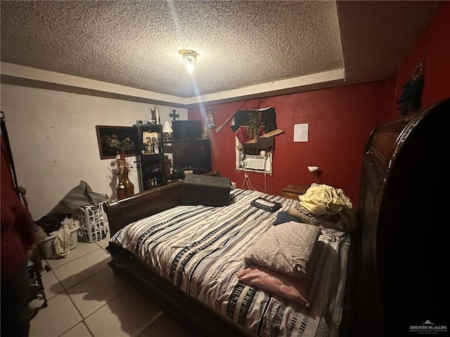 tiled bedroom featuring a textured ceiling