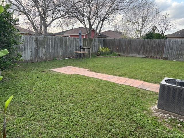 view of yard featuring central AC unit