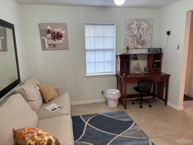 sitting room with light tile patterned floors