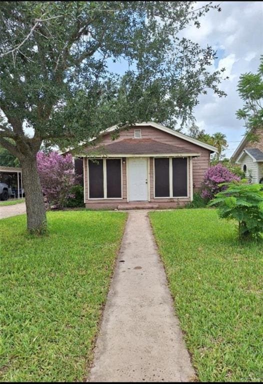 bungalow with a front lawn