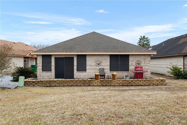 rear view of house with a lawn