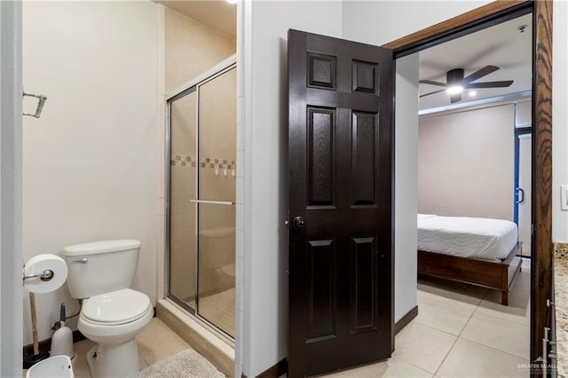 813 Travis St Unit 419, Mission, TX 78572 - ensuite bathroom with toilet, ceiling fan, connected bathroom, tile patterned floors, and a stall shower
