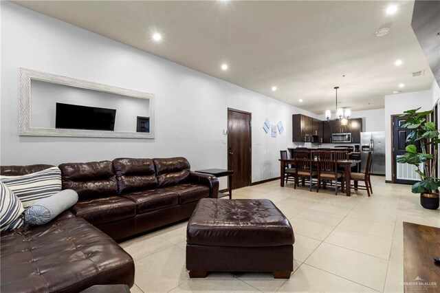813 Travis St Unit 419, Mission, TX 78572 - living room with recessed lighting, baseboards, light tile patterned floors, and a chandelier