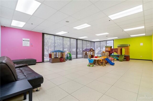 813 Travis St Unit 419, Mission, TX 78572 - recreation room featuring a drop ceiling and expansive windows