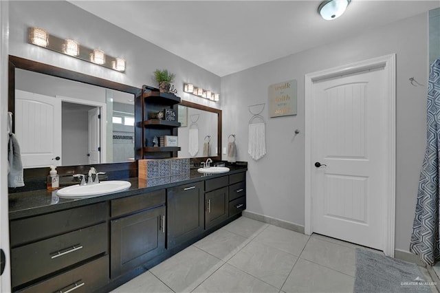 bathroom with tile patterned floors and vanity