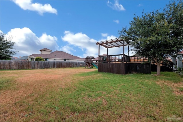 view of yard with a playground and a pergola