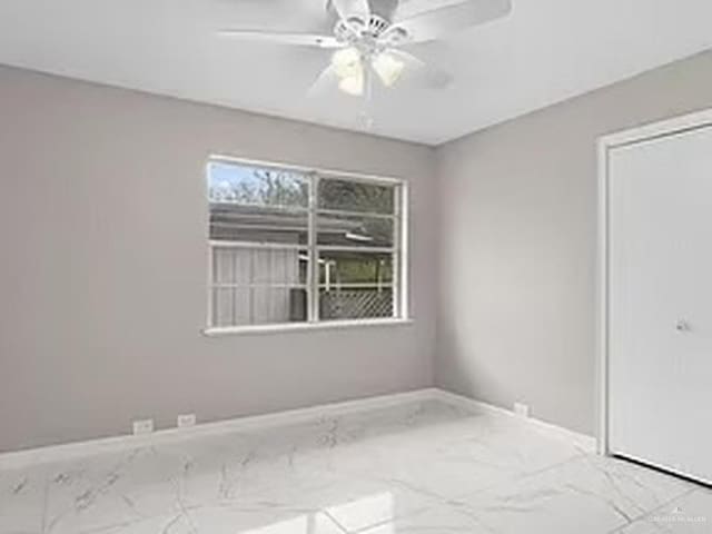 unfurnished room with ceiling fan