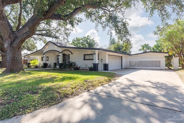 ranch-style house with a front lawn and a garage