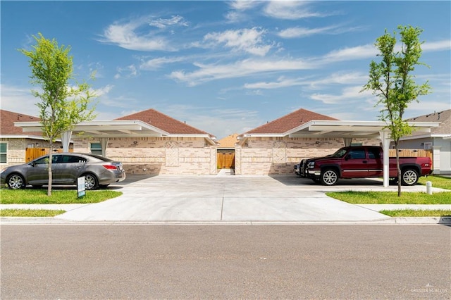 view of front of property featuring a carport