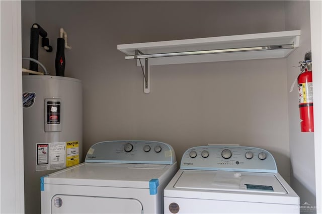 laundry area featuring independent washer and dryer and electric water heater