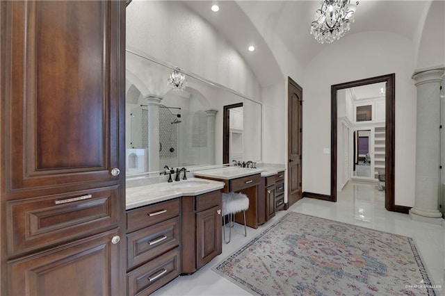 bathroom with a shower, tile patterned flooring, vanity, and vaulted ceiling