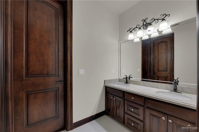 bathroom with tile patterned floors and vanity