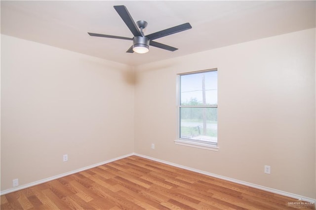 spare room featuring ceiling fan and light hardwood / wood-style flooring