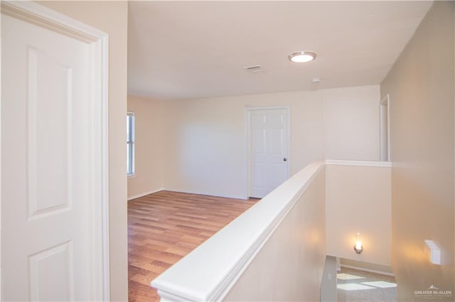 corridor featuring light hardwood / wood-style flooring