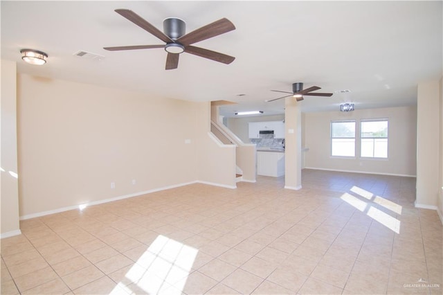 unfurnished living room with ceiling fan and light tile patterned flooring