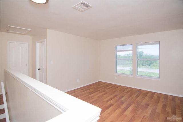 spare room featuring light hardwood / wood-style floors