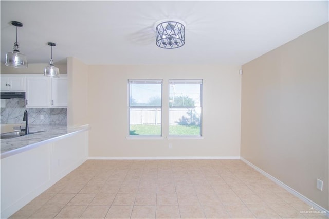 interior space with light tile patterned flooring and sink