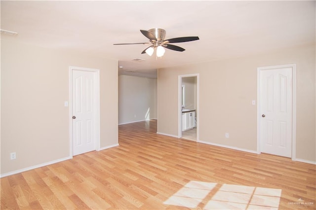 spare room with ceiling fan and light hardwood / wood-style floors