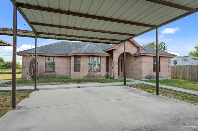 exterior space featuring a carport