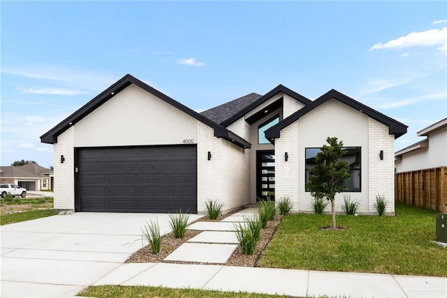 view of front facade featuring a garage and a front lawn