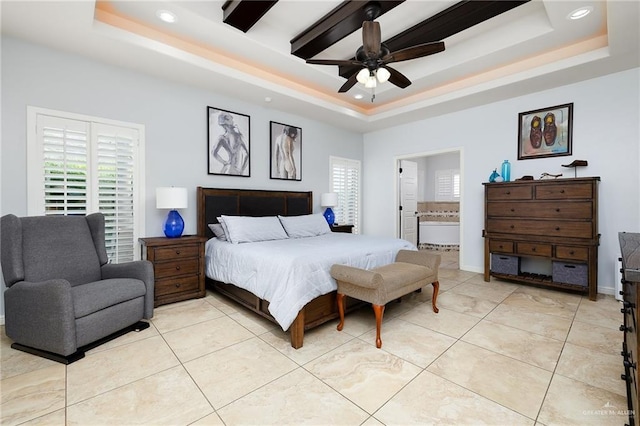 bedroom featuring a raised ceiling, multiple windows, and recessed lighting