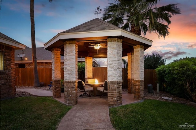 view of patio featuring ceiling fan and a gazebo