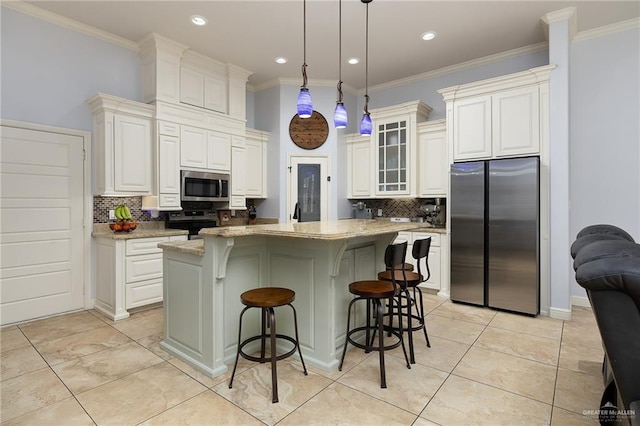 kitchen featuring stainless steel appliances, tasteful backsplash, crown molding, glass insert cabinets, and a kitchen bar