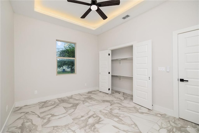 unfurnished bedroom featuring ceiling fan